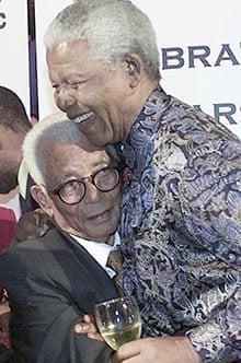 Nelson Mandela embracing Walter Sisulu in 2002