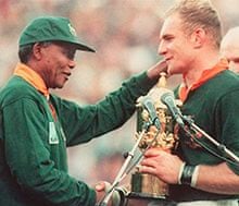 Springbok captain Francois Pienaar receives the Rugby World Cup from Nelson Mandela in 1995