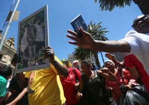 South African mourners sing and dance infront of the Cape Town City Hall where the late South African president Nelson Mandela made his first public address after being released in Cape Town, South Africa, 06 December 2013.