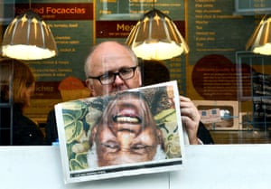 A man in Dublin reads about the death of Nelson Mandela.