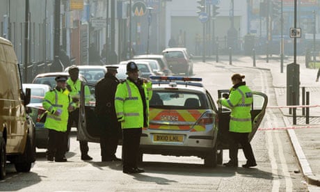 Police officers seal off Hindrey Road in Clapton, east London, following the shooting. 