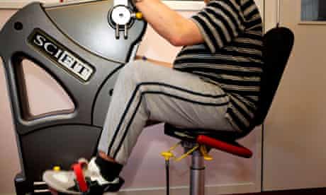 A man sitting at an exercise machine