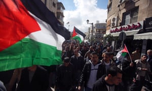 Palestinians take part in a protest in the West Bank city of Ramallah, calling for the release of Palestinian prisoners from Israeli jails on 17 February 2013.