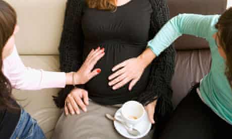 Pregnant woman with coffee