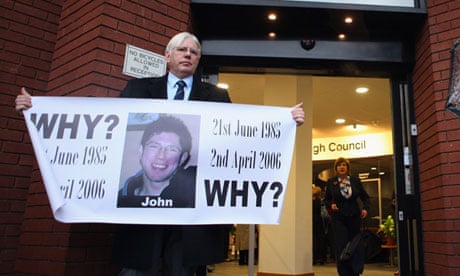 Frank Robinson holds a banner outside Stafford Civic Centre during the Mid Staffs inquiry