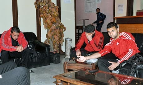 Syrian footballers from the al-Wathbah club after two mortars exploded next to a stadium in Damascus