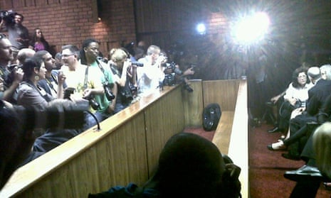Media wait for Oscar Pistorius at Pretoria magistrates court on 22 February 2013