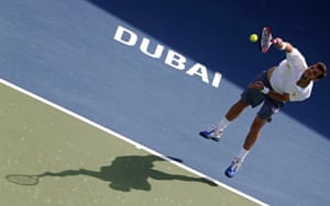 France's Paul-Henri Mathieu serves to Italy's Andreas Seppi during their ATP Dubai Open tennis match in the Gulf emirate.