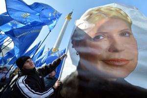 A man holds a flag bearing a picture of jailed former Prime minister Yulia Tymoshenko during a rally called by Ukrainian opposition "against political repression!" on Independence square in Kiev, on the day of the start of the 16th Ukraine-European Union summit in Brussels. Photograph: Sergei Supinsky/AFP/Getty Images
