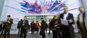 Visitors walk by the Mobile World Congress in Barcelona, Spain. The GSMA Mobile World Congress, representing the interests of the worldwide mobile communications industry, takes place from February 25 to 28 in Barcelona.