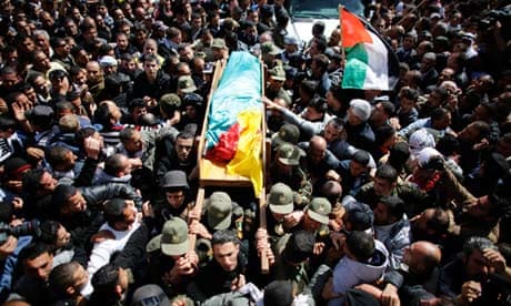 Palestinians carry the body of Arafat Jaradat during his funeral 