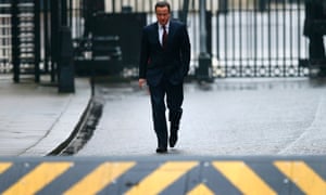 David Cameron returns to Downing Street looking a bit pensive, after taking his daughter to her school in central London.
