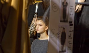 A model waits backstage before the Steffie Christiaen's Fall-Winter 2013/2014 women's ready-to-wear fashion show today, during Paris fashion week.