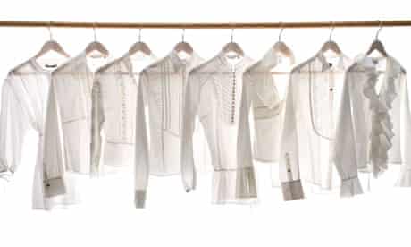 White blouses hanging on a rail