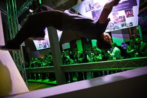 Mobile World Congress: Visitors test new HTC devices as an acrobat performs