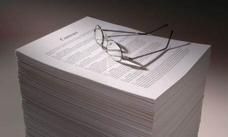 pile of contracts with glasses