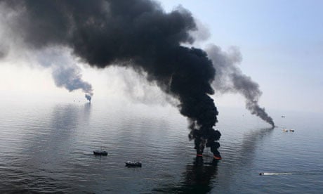 Smoke billows from a controlled burn of spilled oil off the Louisiana coast in the Gulf of Mexico