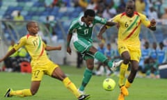 Nigeria's midfielder Ogenyi Onazi is tackled.