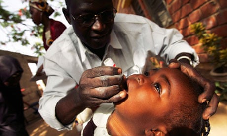 A Nigerian schoolgirl is vaccinated against polio in Kano, Nigeria