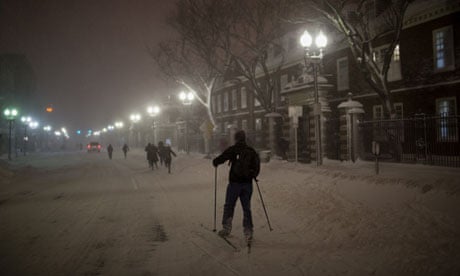 A man skis through Harvard Square in Cambridge, Massachusetts