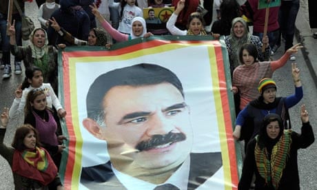 Kurdish supporters of the Kurdistan Workers party (PKK) carrying a posters of Abdullah Öcalan