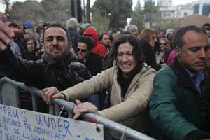 Cypriots protest outside the parliament building in the capital Nicosia on March 22, 2013, as the east Mediterranean island' two biggest lenders urged lawmakers to adopt a tax on bank deposits, a controversial deal with the EU that the MPs rejected this week.