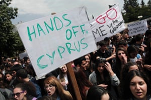 Cypriot students shout slogans  during a protest against the bailout package outside the presidential palace in capital Nicosia, on Tuesday, March 26, 2013.