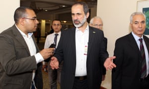 Moaz al-Khatib  speaks to media during the Arab League summit in Doha