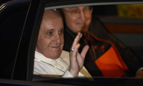 Pope Francis waves as he leaves Casal del Marmo prison in Rome