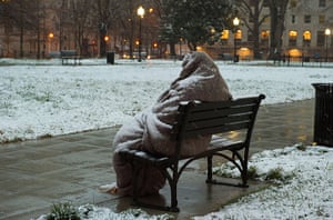 20 photos: A homeless man sits covered in Washington