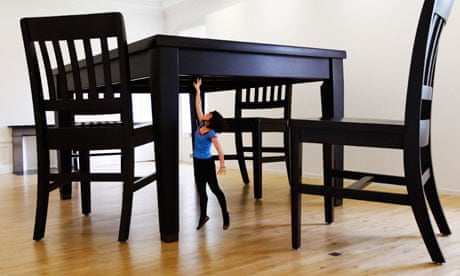 a woman reaching for an oversized table