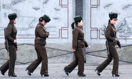 Female North Korean soldiers on patrol along the banks of Yalu River, near the North Korean town of Sinuiju, opposite the Chinese border city of Dandong.