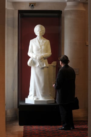 Matthew Young, 69, from Canterbury, Kent, looks at a statue of Baroness Thatcher, at the Guildhall Art Gallery in central London where he wrote a message in a book of condolence.