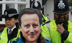 The Laughing Policeman. British Prime Minister David Cameron came in for some stick earlier today during a protest outside the house of David Freud, Britain's Parliamentary Under Secretary of State for Welfare Reform, in north London.
