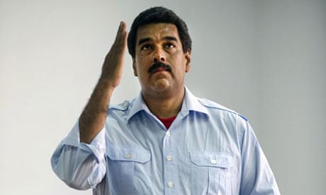 Nicolas Maduro gestures as he casts his vote in an election that has made him president