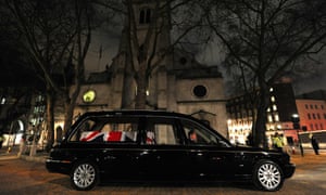 A hearse carrying a coffin waits outside St Clement Danes church during the dress rehearsal.