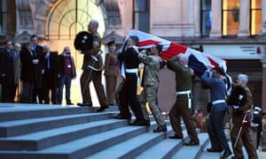 Bearer Party from the three military services carry a coffin up the steps of St Paul's Cathedral during a rehearsal for the ceremonial funeral of Lady Thatcher.