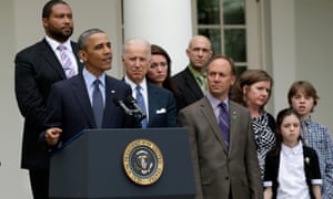 Barack Obama speaks on gun violence as Newtown families look on in the Rose Garden of the White House.