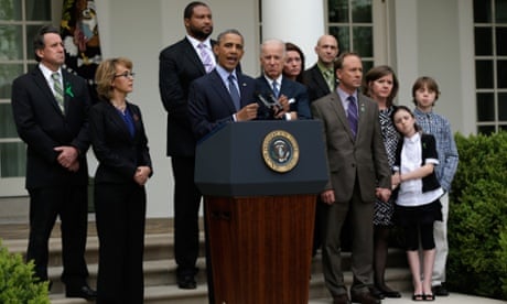 Barack Obama speaks on the Senate gun control vote as former US Representative Gabrielle Giffords and Newtown families look on in the Rose Garden of the White House.