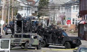 Members of a Swat team search for 19-year-old bombing suspect Dzhokhar Tsarnaev on April 19, 2013 in Watertown, Massachusetts