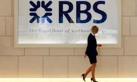 A worker walks in the foyer of a Royal Bank of Scotland office in the City of London