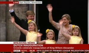 The new King and Queen of the Netherlands, and their daughters, wave to the crowd in Dam Square