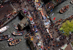 King Willem inauguration: People celebrate the investiture on boats on a canal in Amsterdam
