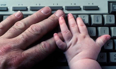 baby's and man's hand on keyboard