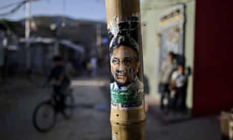 A poster of former Pakistani president Pervez Musharraf on a pole in Islamabad