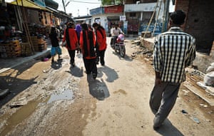 The Red Brigade walk through the Midiyav slum