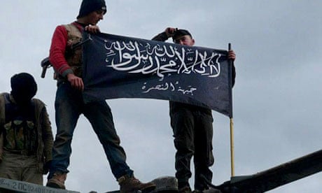 Jabhat al-Nusra fighters at Taftanaz airbase, Idlib province, in January 2013
