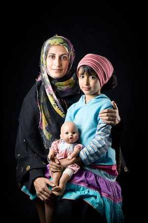 big picture - hijab: middle eastern woman with headscarf and child and doll