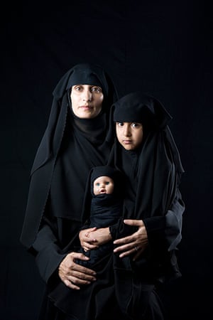 big picture - hijab: middle eastern woman with black hijab and child and doll