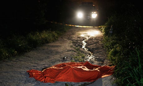Covered-up body of a man shot dead in San Pedro Sula